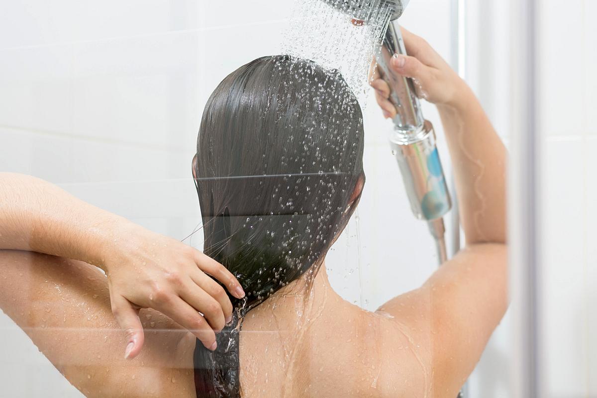 Girl washing hair under shower Reasons to Love Tyent Water Ionizers, Part 9: Tyent Alkaline Water Is The Healthiest Water In The World. Dare To Compare!